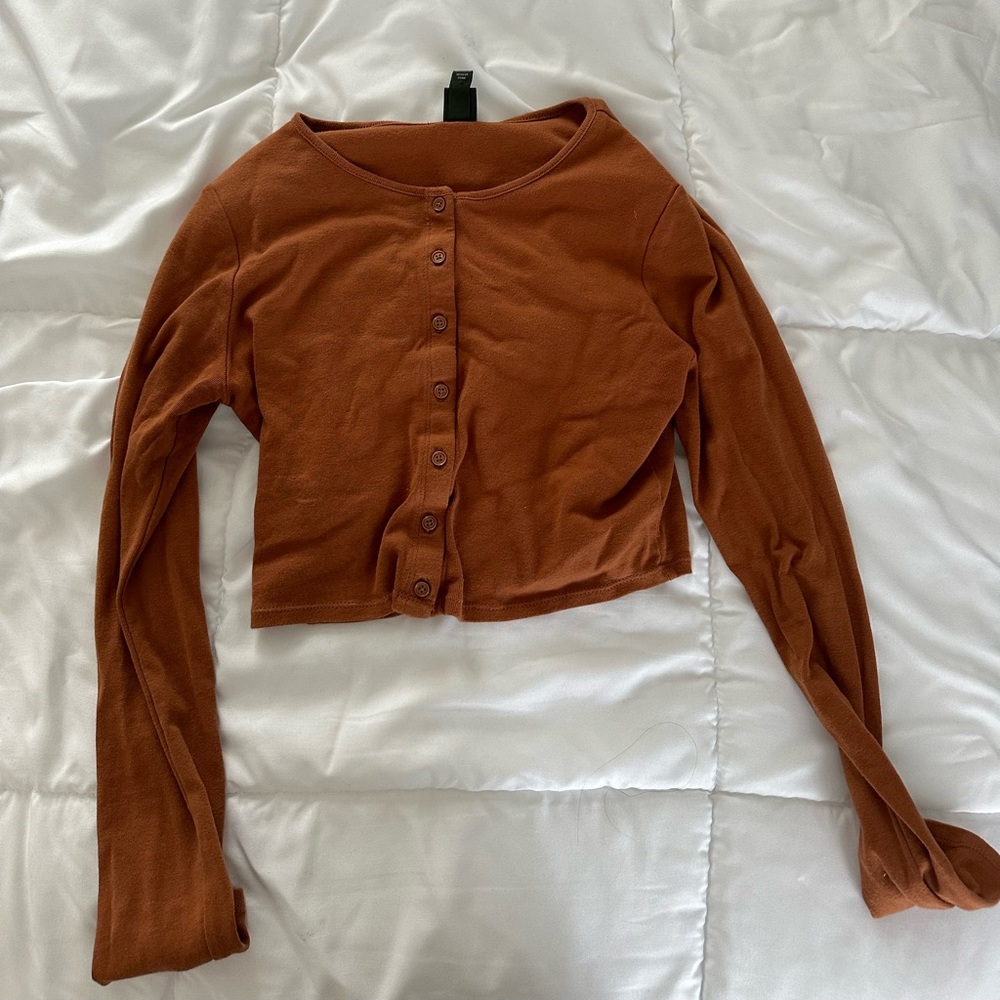 brown long sleeve button up shirt.